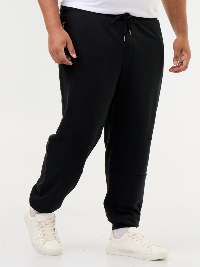 Pantalon de jogging avec bas resserré et poches zippées Noir - Kiabi