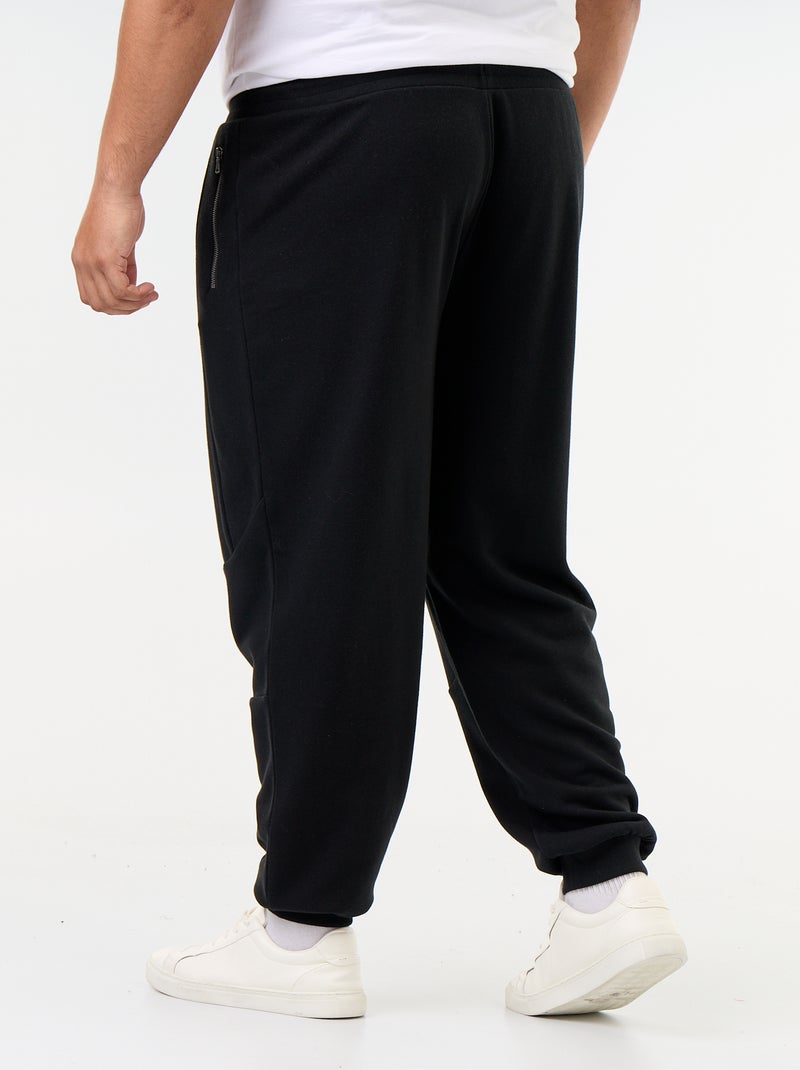 Pantalon de jogging avec bas resserré et poches zippées Noir - Kiabi