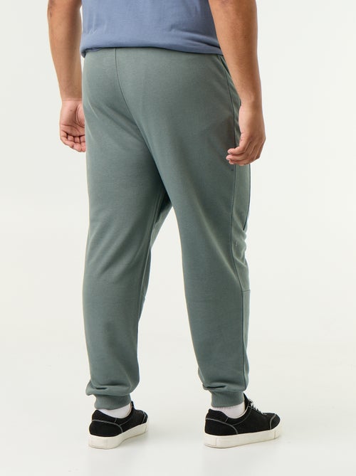 Pantalon de jogging avec bas resserré et poches zippées - Kiabi