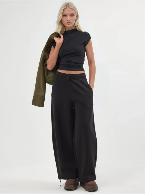 Pantalon de jogging en maille mélangée coton femme busem - Kiabi Pantalon de jogging en maille mélangée coton femme busem - Kiabi