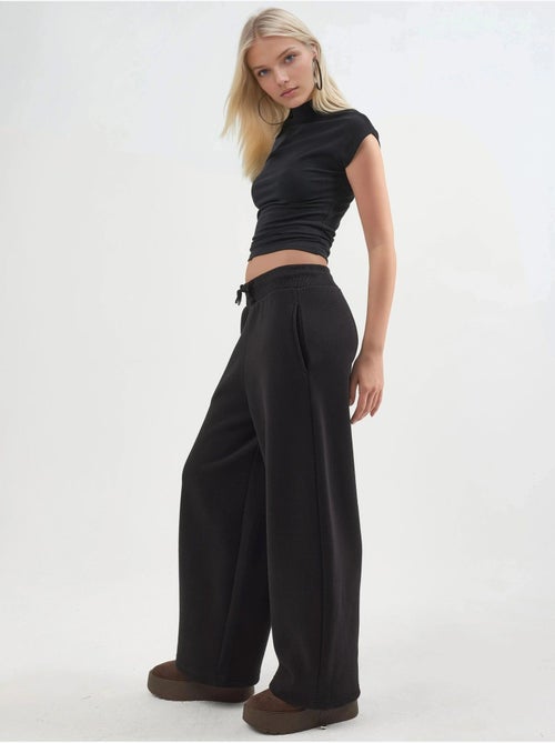 Pantalon de jogging en maille mélangée coton femme busem - Kiabi Pantalon de jogging en maille mélangée coton femme busem - Kiabi