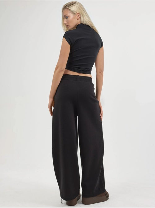 Pantalon de jogging en maille mélangée coton femme busem - Kiabi Pantalon de jogging en maille mélangée coton femme busem - Kiabi