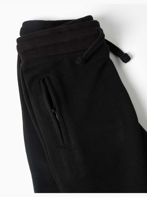Pantalon de jogging en molleton avec cordon de serrage et poches - Kiabi Pantalon de jogging en molleton avec cordon de serrage et poches - Kiabi