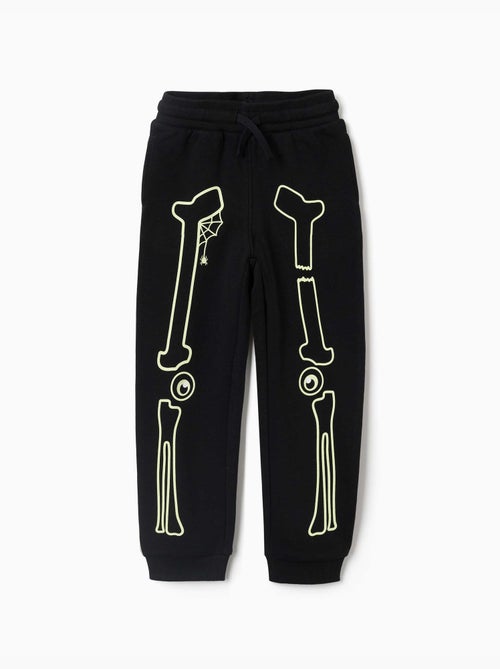 Pantalon de jogging en molleton avec imprimé qui brille dans le noir - Kiabi Pantalon de jogging en molleton avec imprimé qui brille dans le noir - Kiabi