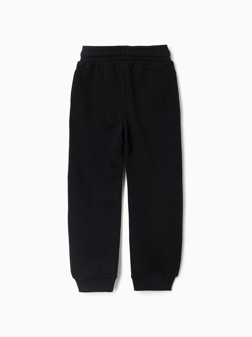 Pantalon de jogging en molleton avec imprimé qui brille dans le noir - Kiabi Pantalon de jogging en molleton avec imprimé qui brille dans le noir - Kiabi