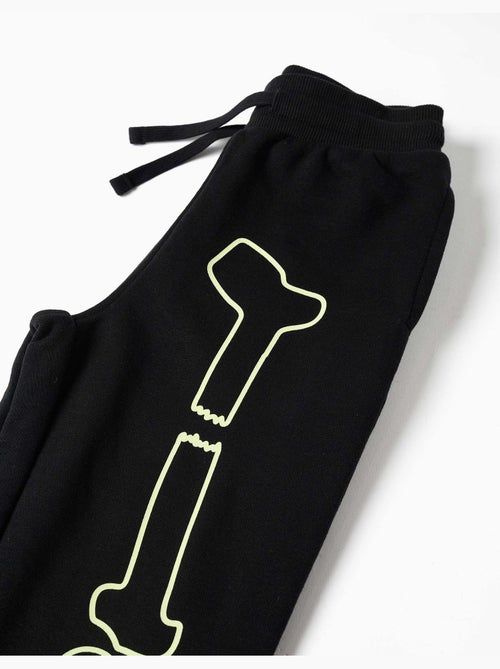 Pantalon de jogging en molleton avec imprimé qui brille dans le noir - Kiabi Pantalon de jogging en molleton avec imprimé qui brille dans le noir - Kiabi