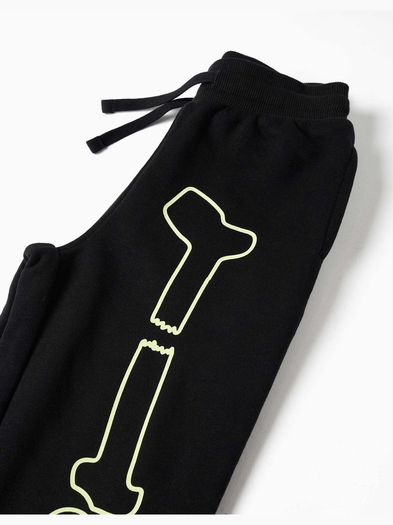 Pantalon de jogging en molleton avec imprimé qui brille dans le noir Noir Noir - Kiabi