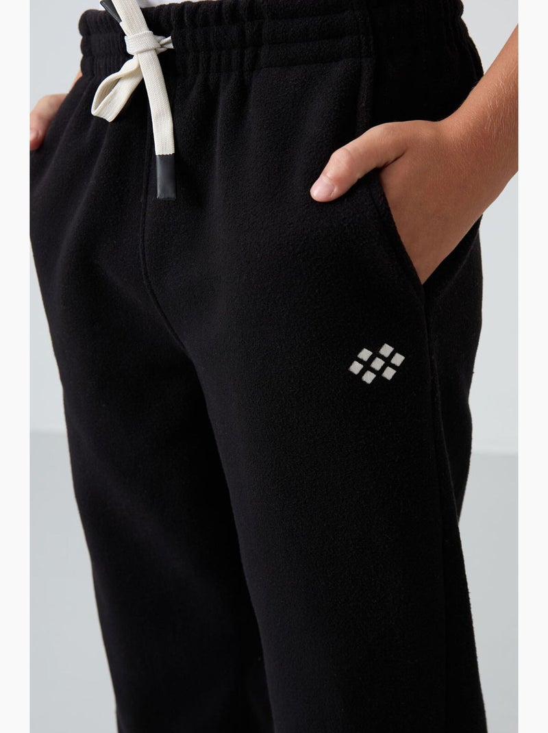 Pantalon de jogging enfant tommy Noir - Kiabi