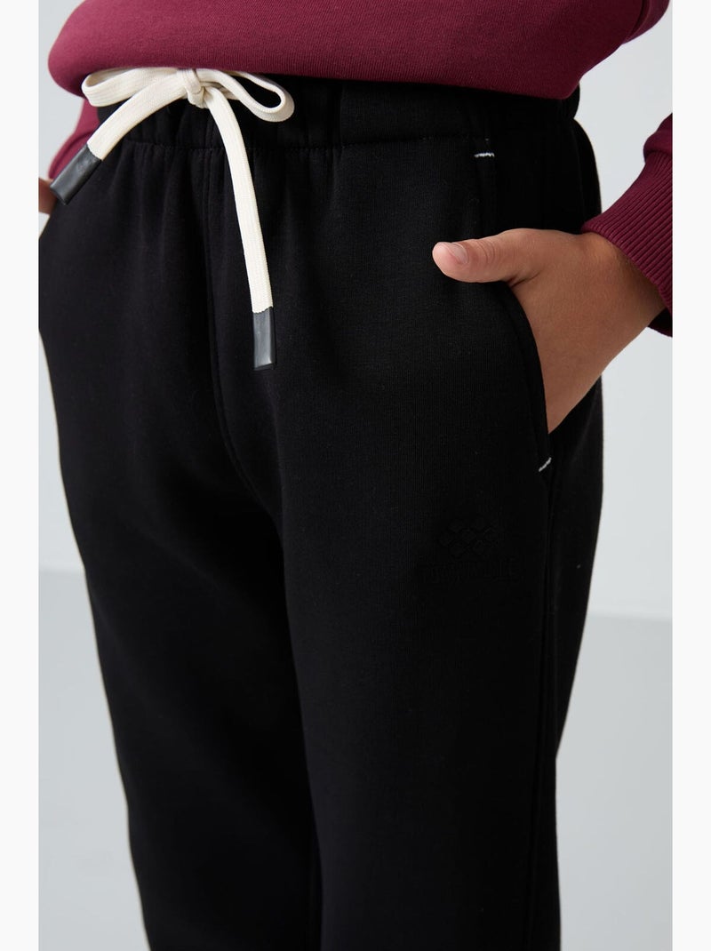 Pantalon de jogging enfant tommy Noir - Kiabi