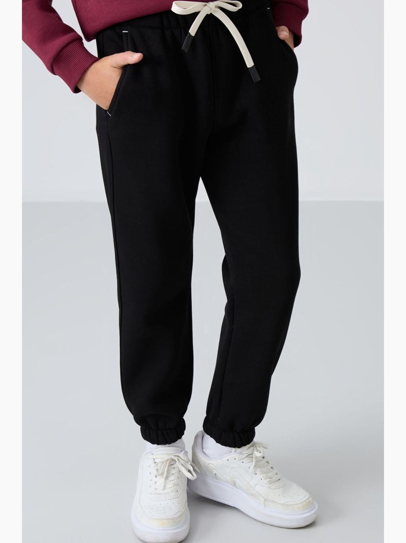 Pantalon de jogging enfant tommy Noir - Kiabi