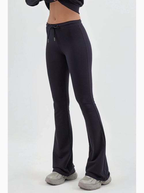 Pantalon de jogging évasé taille mi-haute avec cordon busem - Kiabi Pantalon de jogging évasé taille mi-haute avec cordon busem - Kiabi