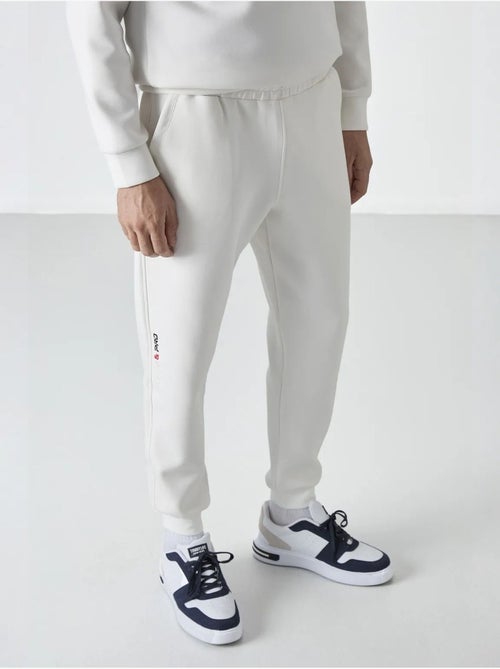 Pantalon de jogging homme à jambe fuselée tommy - Kiabi Pantalon de jogging homme à jambe fuselée tommy - Kiabi