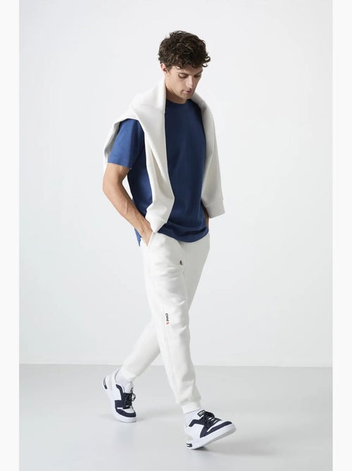 Pantalon de jogging homme à jambe fuselée tommy - Kiabi Pantalon de jogging homme à jambe fuselée tommy - Kiabi