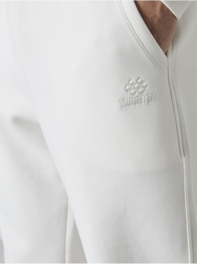 Pantalon de jogging homme à jambe fuselée tommy Blanc cassé - Kiabi