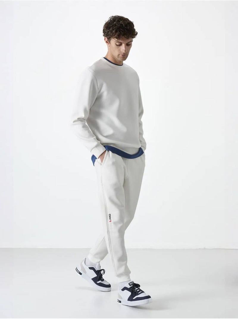 Pantalon de jogging homme à jambe fuselée tommy Blanc cassé - Kiabi