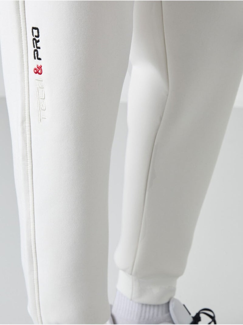Pantalon de jogging homme à jambe fuselée tommy Blanc cassé - Kiabi