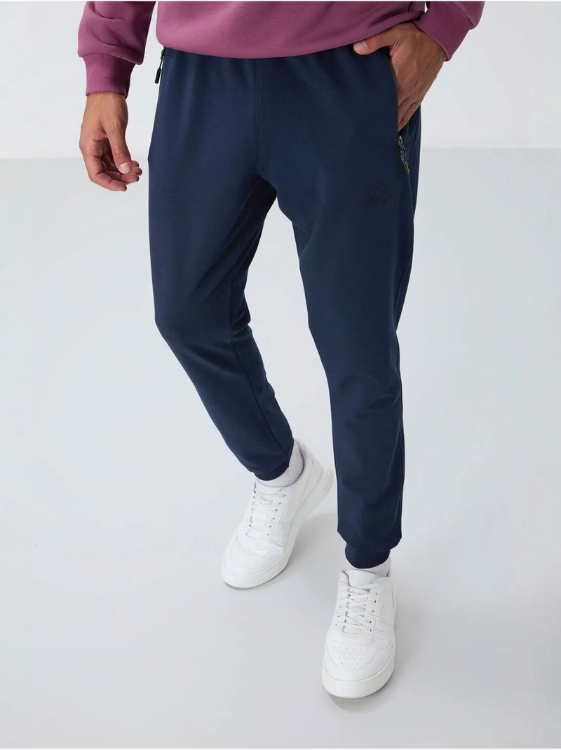 Pantalon de jogging homme avec poche zippée tommy Bleu marine - Kiabi
