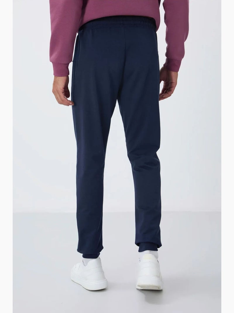 Pantalon de jogging homme avec poche zippée tommy Bleu marine - Kiabi