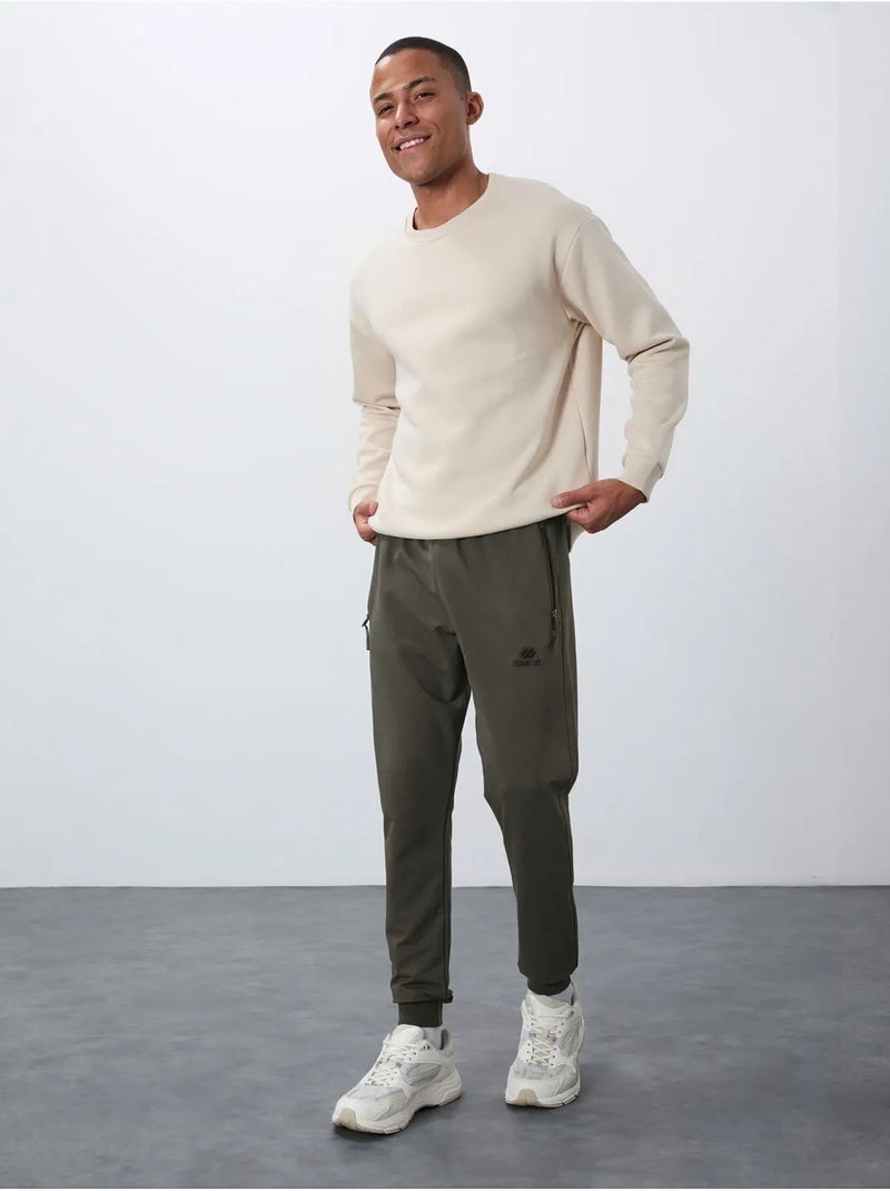 Pantalon de jogging homme avec poche zippée tommy Vert kaki - Kiabi