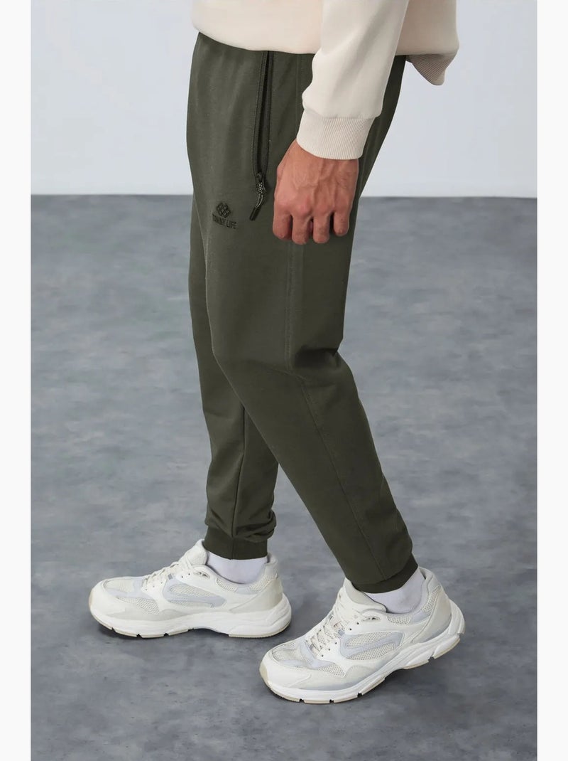 Pantalon de jogging homme avec poche zippée tommy Vert kaki - Kiabi