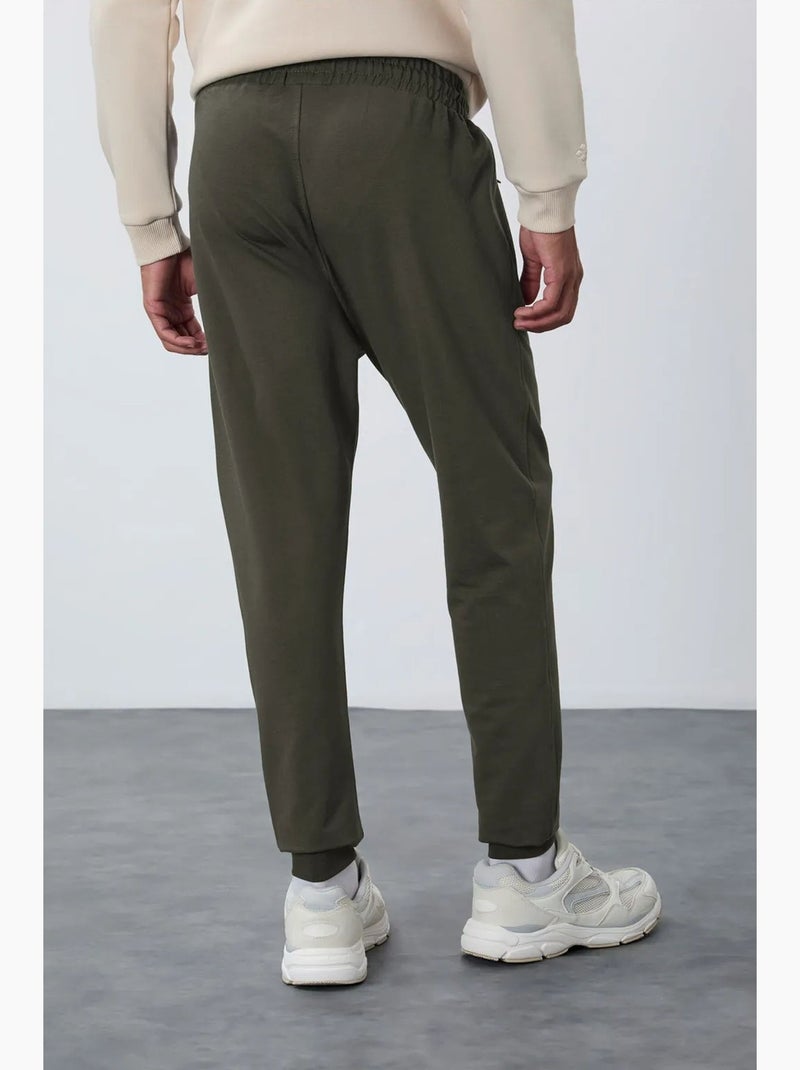 Pantalon de jogging homme avec poche zippée tommy Vert kaki - Kiabi