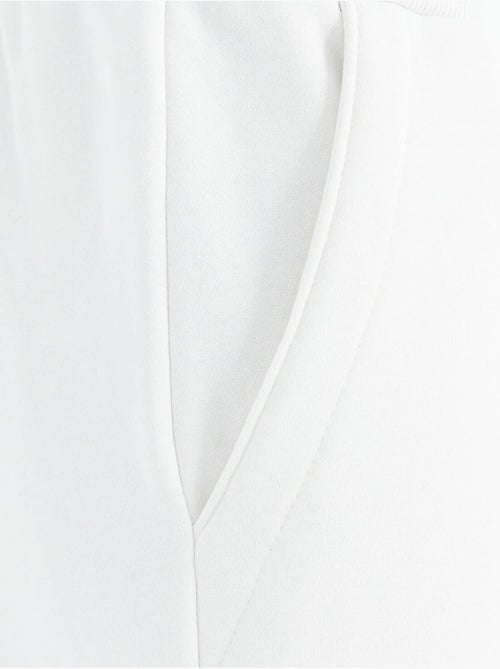 Pantalon de jogging homme coupe décontractée en molleton tommy - Kiabi Pantalon de jogging homme coupe décontractée en molleton tommy - Kiabi