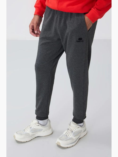 Pantalon de jogging homme en molton uni tommy - Kiabi Pantalon de jogging homme en molton uni tommy - Kiabi