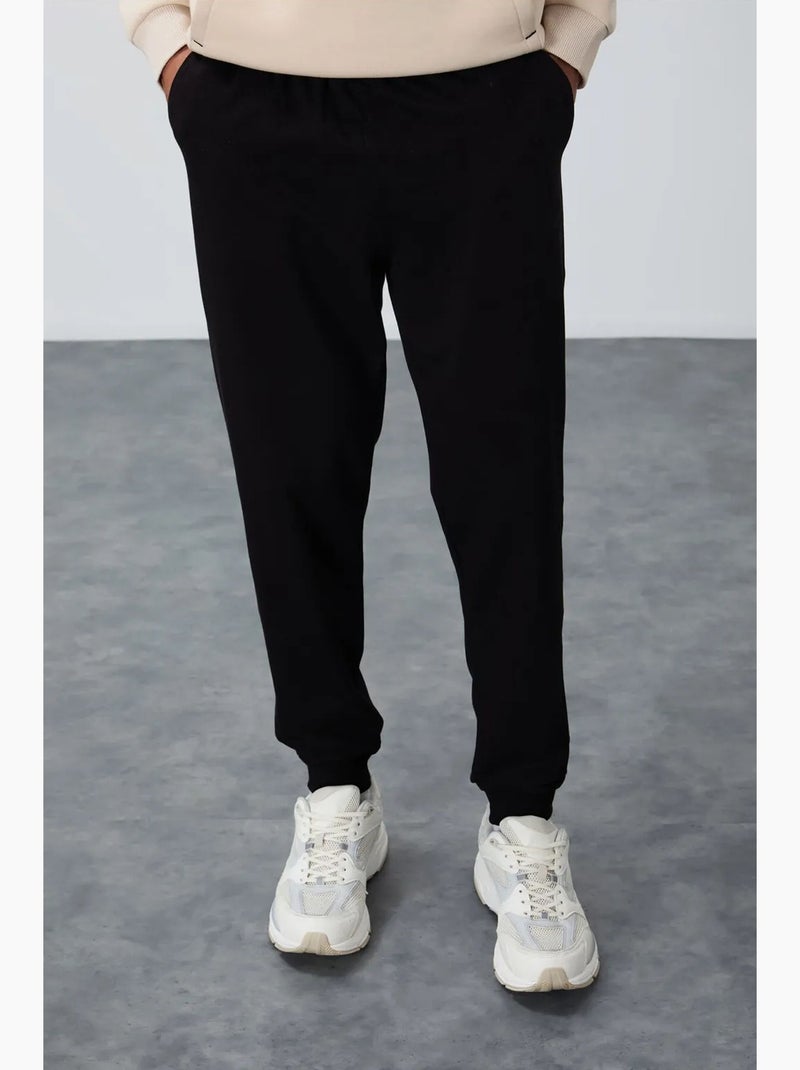Pantalon de jogging homme en molton uni tommy Noir - Kiabi