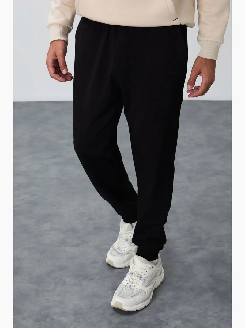 Pantalon de jogging homme en molton uni tommy Noir - Kiabi