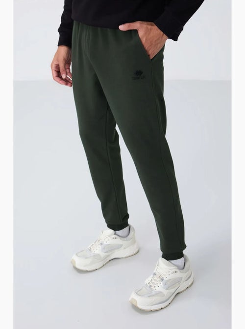 Pantalon de jogging homme en molton uni tommy - Kiabi Pantalon de jogging homme en molton uni tommy - Kiabi