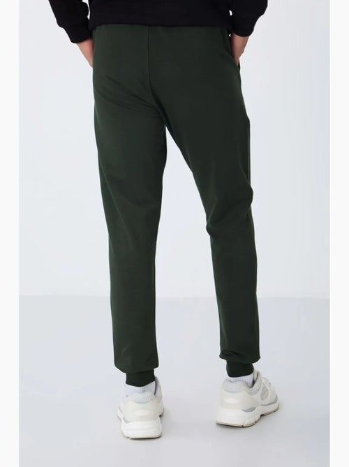 Pantalon de jogging homme en molton uni tommy - Kiabi Pantalon de jogging homme en molton uni tommy - Kiabi
