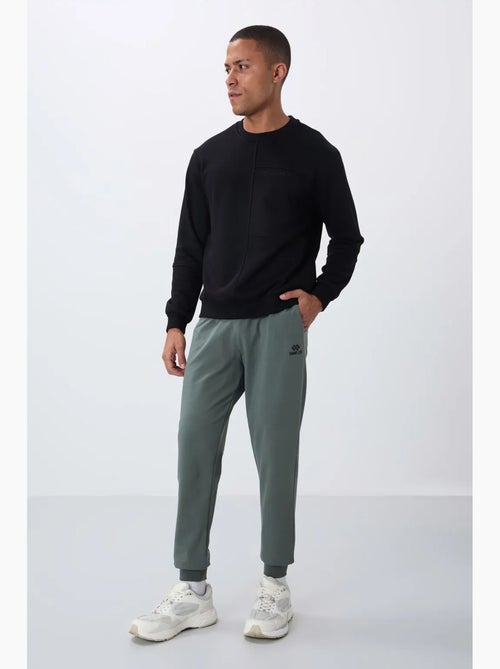 Pantalon de jogging homme en molton uni tommy - Kiabi Pantalon de jogging homme en molton uni tommy - Kiabi