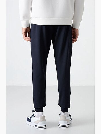 Pantalon de jogging homme uni avec poche zippée tommy
