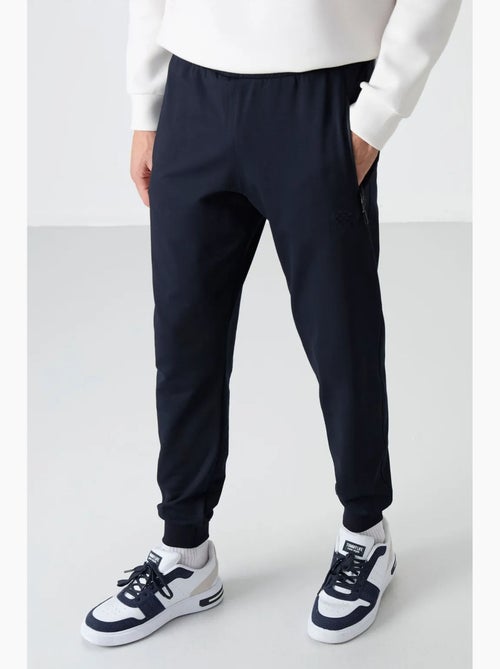 Pantalon de jogging homme uni avec poche zippée tommy - Kiabi Pantalon de jogging homme uni avec poche zippée tommy - Kiabi