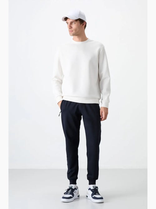 Pantalon de jogging homme uni avec poche zippée tommy - Kiabi Pantalon de jogging homme uni avec poche zippée tommy - Kiabi