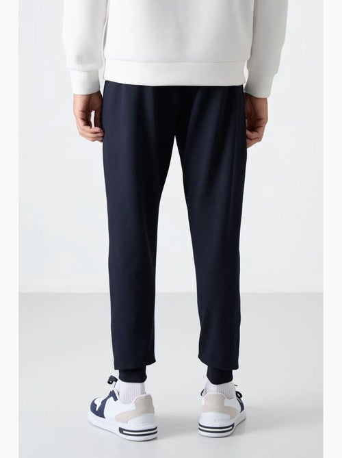 Pantalon de jogging homme uni avec poche zippée tommy - Kiabi Pantalon de jogging homme uni avec poche zippée tommy - Kiabi