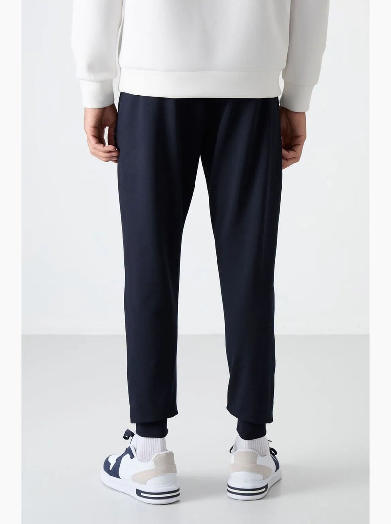Pantalon de jogging homme uni avec poche zippée tommy Bleu marine - Kiabi