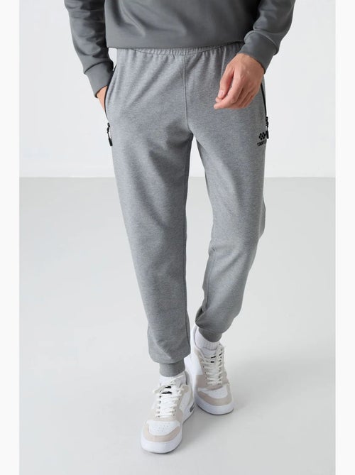 Pantalon de jogging homme uni avec poche zippée tommy - Kiabi Pantalon de jogging homme uni avec poche zippée tommy - Kiabi