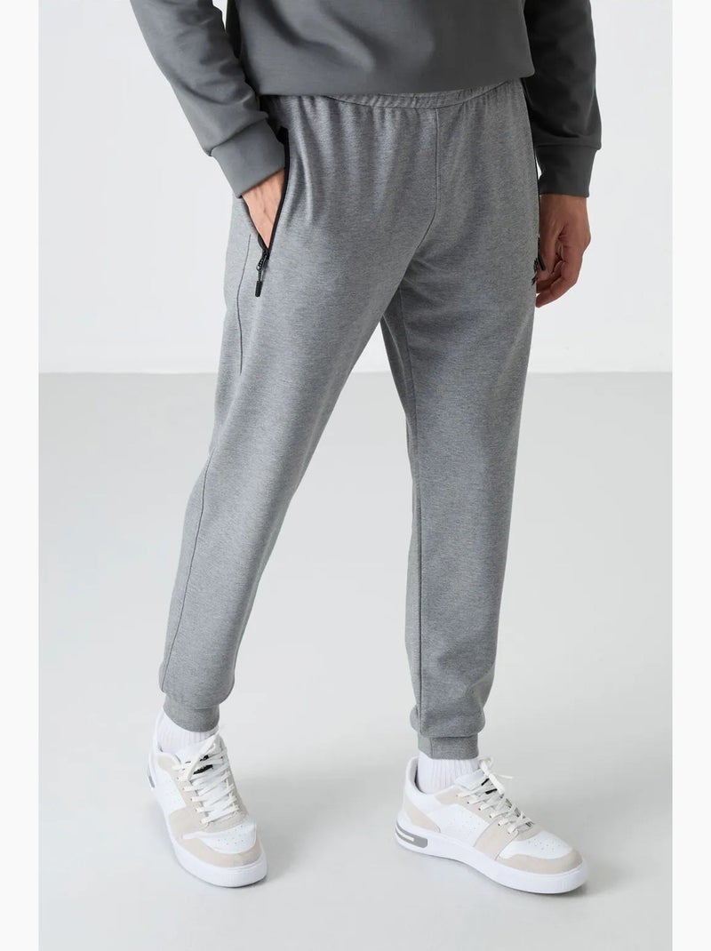 Pantalon de jogging homme uni avec poche zippée tommy Gris - Kiabi