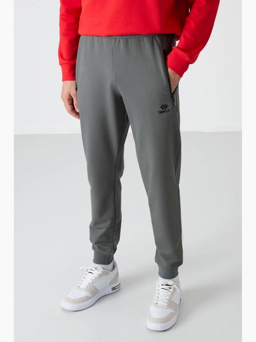 Pantalon de jogging homme uni avec poche zippée tommy - Kiabi Pantalon de jogging homme uni avec poche zippée tommy - Kiabi