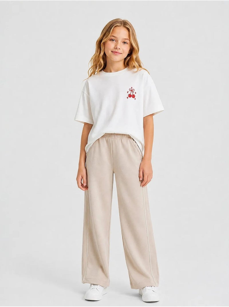 Pantalon de jogging jeunesse à taille élastique jambe large tommy Beige argile - Kiabi