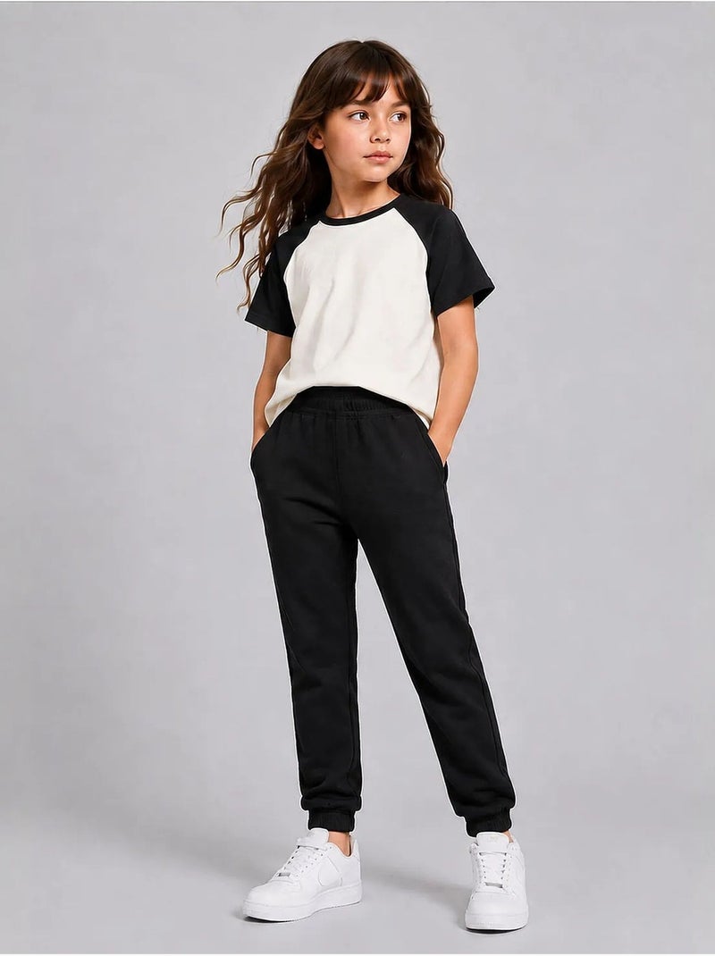 Pantalon de jogging unisexe junior à jambe fuselée tommy Noir - Kiabi