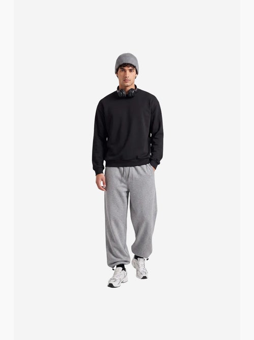Pantalon de survêtement homme en mélange de coton tommy - Kiabi Pantalon de survêtement homme en mélange de coton tommy - Kiabi