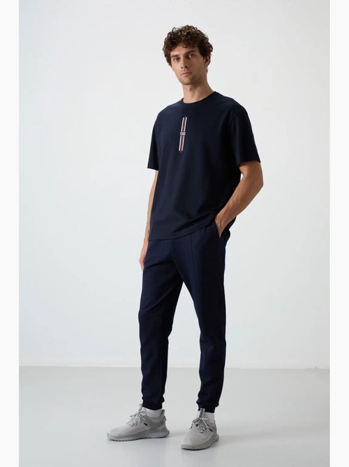 Pantalon de survêtement homme jogger en molleton tommy - Kiabi Pantalon de survêtement homme jogger en molleton tommy - Kiabi