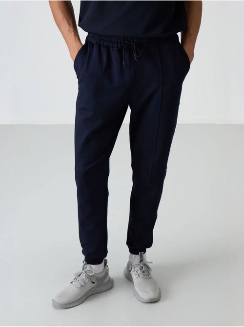 Pantalon de survêtement homme jogger en molleton tommy - Kiabi Pantalon de survêtement homme jogger en molleton tommy - Kiabi