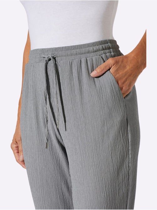 Pantalon décontracté avec ceinture élastique et poches latérales - Taille standard - Moda Vilona - Kiabi Pantalon décontracté avec ceinture élastique et poches latérales - Taille standard - Moda Vilona - Kiabi