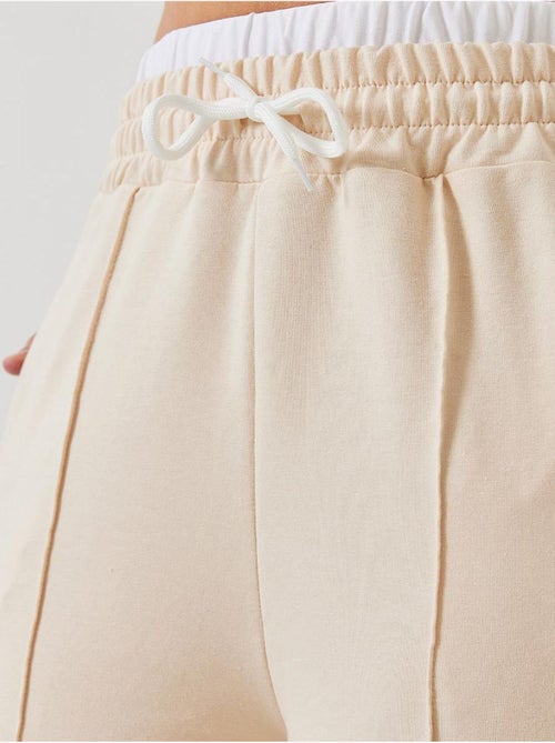 Pantalon élastique à taille nouée lucci - Kiabi Pantalon élastique à taille nouée lucci - Kiabi
