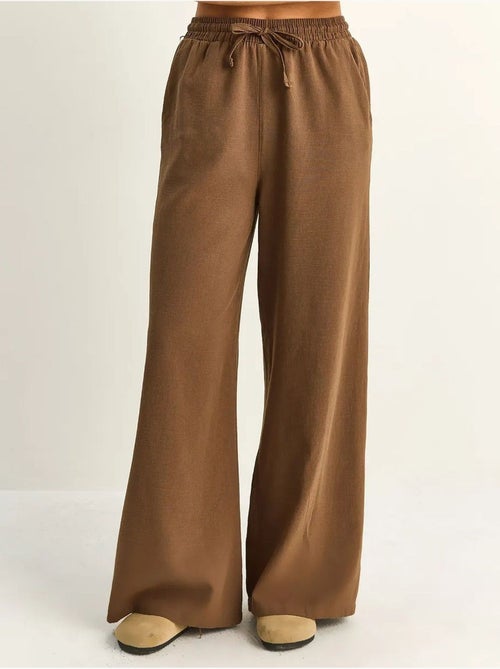 Pantalon en coton à jambes larges avec cordon à la taille lucci - Kiabi Pantalon en coton à jambes larges avec cordon à la taille lucci - Kiabi