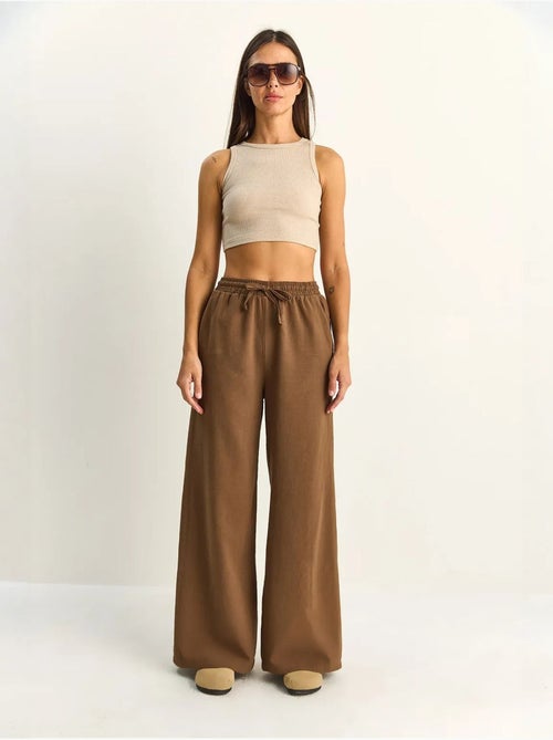 Pantalon en coton à jambes larges avec cordon à la taille lucci - Kiabi Pantalon en coton à jambes larges avec cordon à la taille lucci - Kiabi