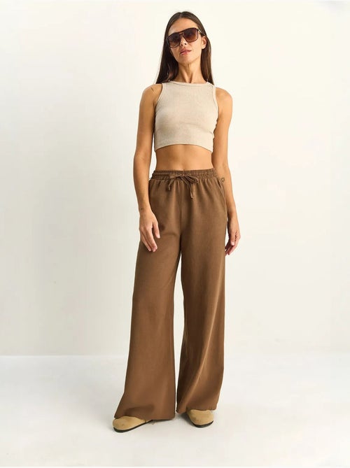 Pantalon en coton à jambes larges avec cordon à la taille lucci - Kiabi Pantalon en coton à jambes larges avec cordon à la taille lucci - Kiabi